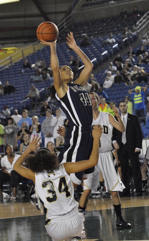 Kat Cooper elevates for two points against Mead in the Washington State 4A girls basketball title game this past season. Cooper