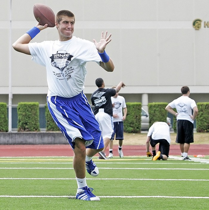 Auburn Mountainview's Domenic Rockey runs through quarterback drills at the Tanoa Bowl camp at Auburn Mountainview this past weekend.