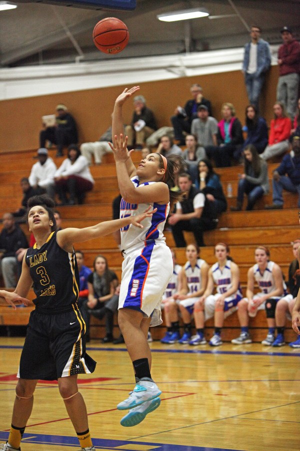 Allison Hammer elevates for a bucket against Lincoln during the West Central District III/Southwest District 4 tournament.