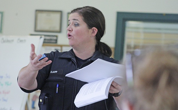 Auburn Police Officer April Clapp joins residents and residential managers to discuss and solve issues at a recent get-together at The River