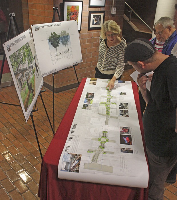 Preview: Residents and business owners study one of two perspectives for the downtown commercial corridor during an open house in the City Hall lobby.