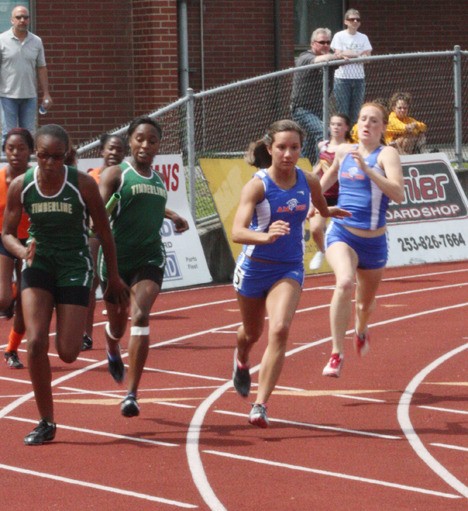 Whitney Echols hands off the baton to Erika Lombardo for the anchor leg of the girl's 4x100 relay.