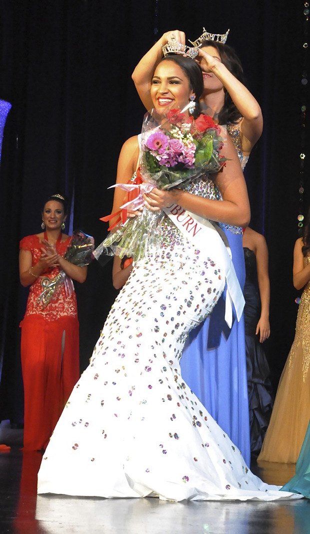 Pageant winner Morgan Warren receives the crown from 2014 Miss Auburn Jacque Guyette at the coronation Saturday night.