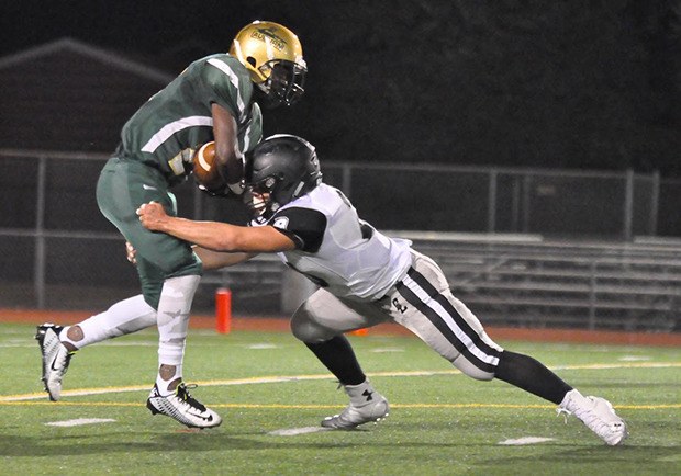 Bonney Lake's Jason Day applies the stop to Auburn's Kevin Clay during SPSL 3A action Thursday night.