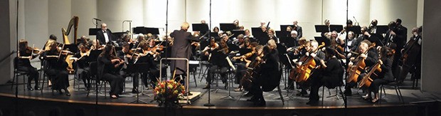 Conductor Stewart Kershaw leads the Auburn Symphony Orchestra as it performs its season-opening concert at the remodeled Performing Arts Center last Sunday. For future concert information and to order tickets
