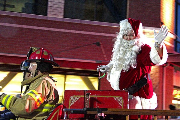 Santa Claus waves to the crowd at Auburn's Santa Parade.