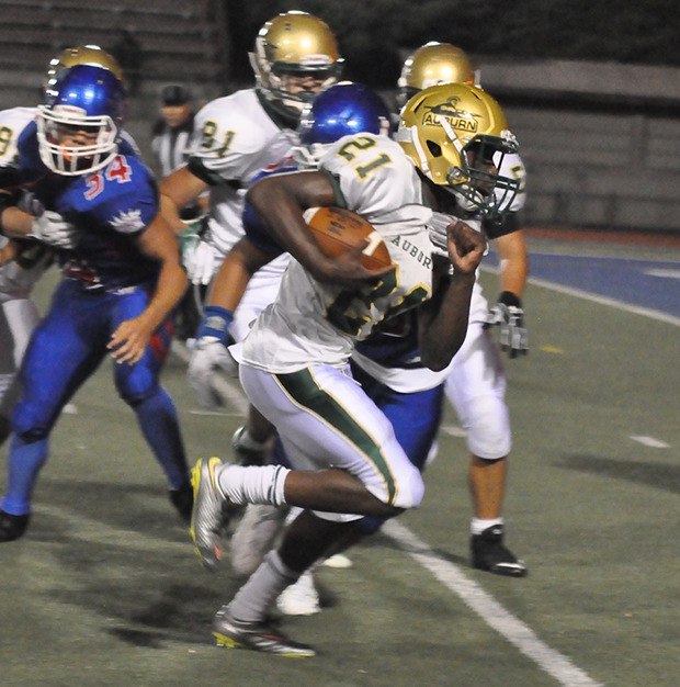 Auburn's Joseph Fagan dashes to a touchdown against Kent-Meridian on Friday night at French Field.