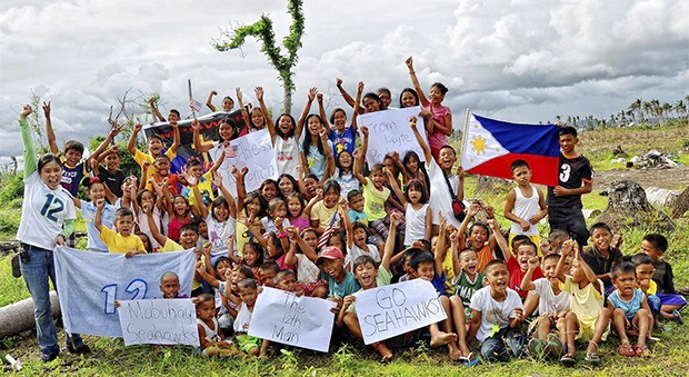 The Filipino children of devastated Tacloban are cheering on the Seahawks in the Super Bowl.