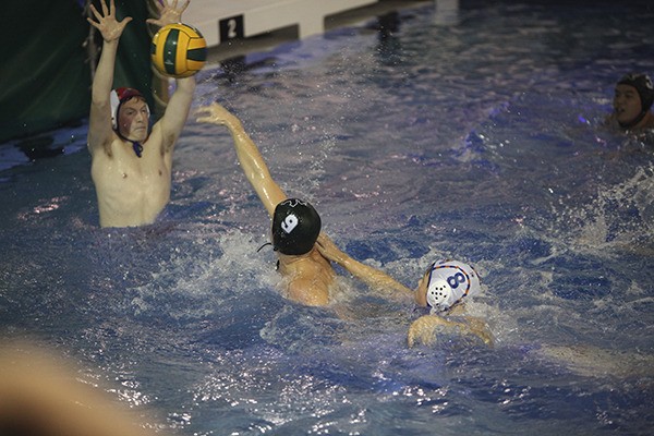 Auburn Mountainview goalkeeper Brandon Burt defends against Kentwood's Cole Hendricks (No. 9)
