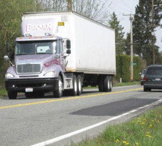 The city is looking at ways to treat Auburn's worn truck routes
