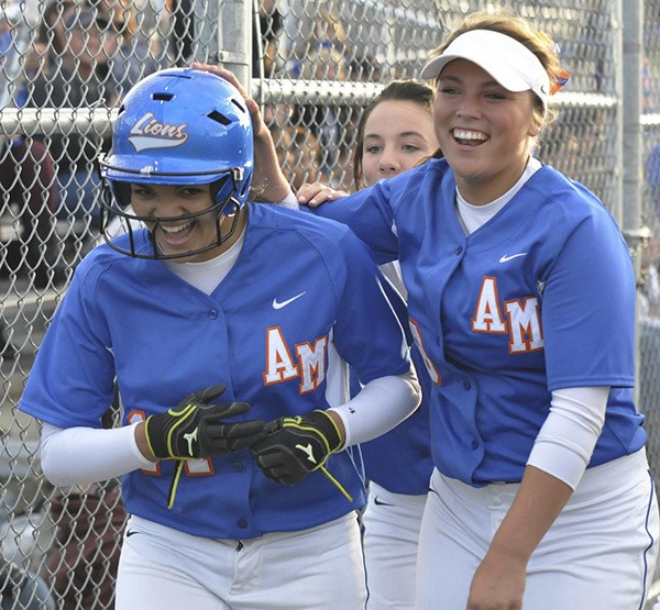 Auburn Mountainview's Delene Colburn congratulates teammate Emily Martinez for her home run.