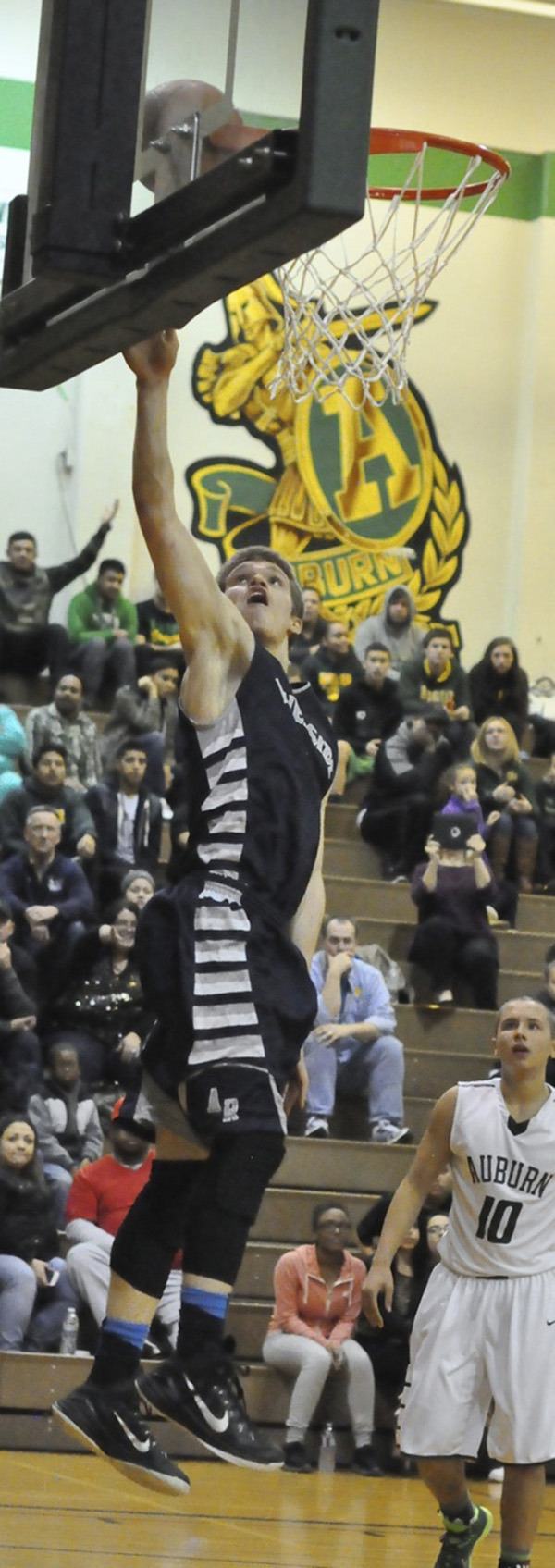 Auburn Riverside senior guard Mitch Wetmore in action against rival Auburn.