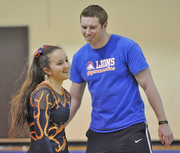 Auburn Mountainview head coach Andrew Stranack cheers on one of his gymnasts.