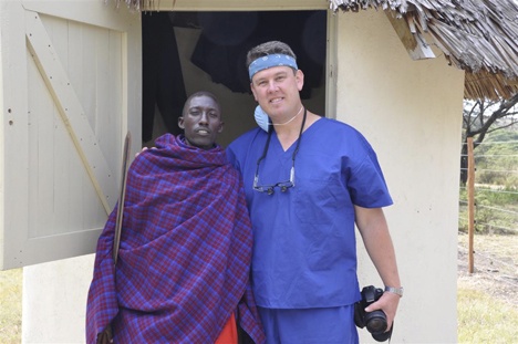 Dr. Stuart Rich poses with an ‘ascari’ or guard in front of the guard house at the clinic gate in Kenya. Yes