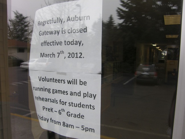Signs notify parents that Auburn's Gateway School has closed.