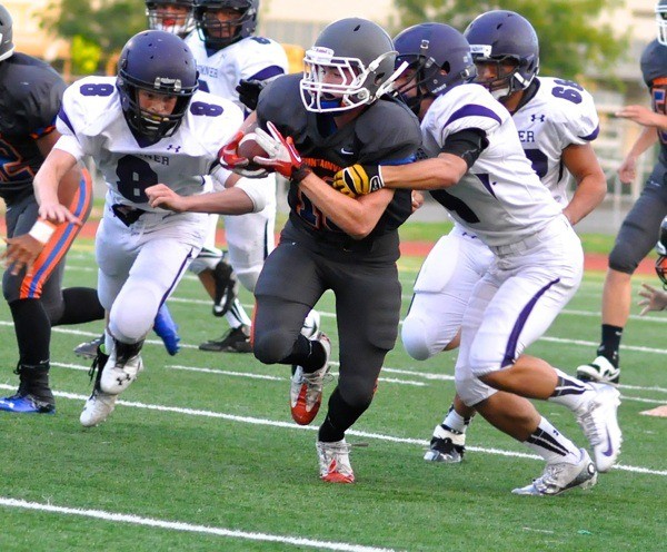 Junior Jesse Weathers tries to make his way through the Spartan defense.