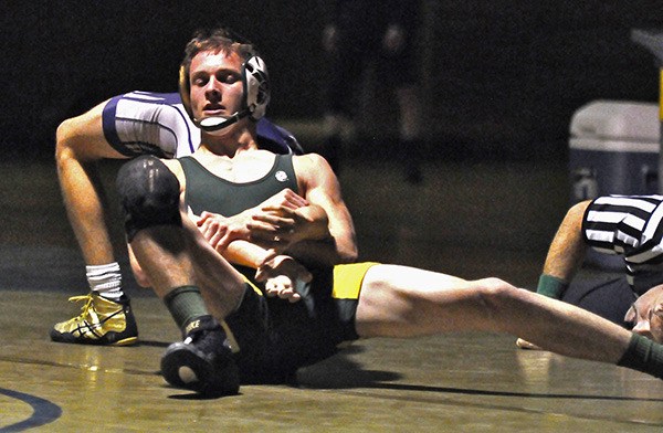 Auburn 120 pounder Drew Aplin in action during a dual against Auburn Riverside.