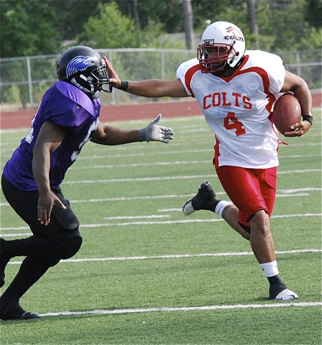 South King County Colts’ Ryan Reynolds tries to shed a Renton Ravens’ pursuer during recent action. The Colts