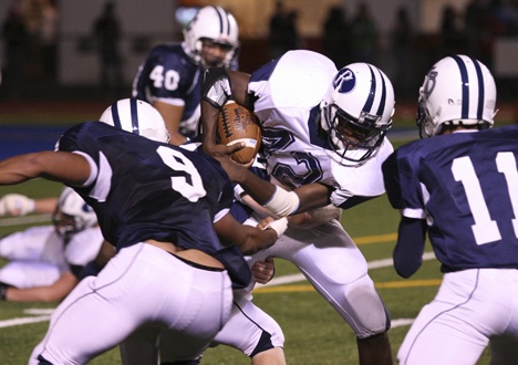 Auburn Riverside running back Keyonte Scott fights for yardage against the Todd Beamer defense during last week’s SPSL game.