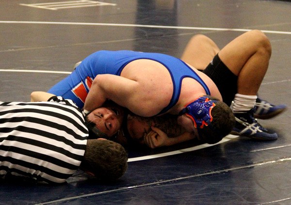 Auburn Mountainview's 285-pound Dakota Weir pins Lincoln's Eric Pula. Weir qualified for the Washington State Mat Classic XXV 3A championships.