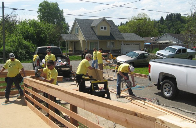 Volunteers from Quadrant Homes recently built a new ramp for disabled homeowners