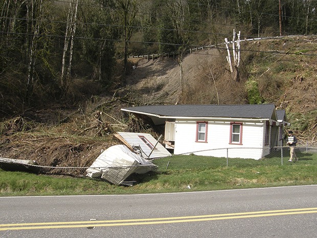 Heavy rains brought part of the West Hill down on this house on West Valley Highway north of Ellingson Road early Wednesday morning