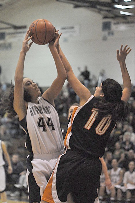Auburn Riverside forward Kat Cooper fires off a shot during the Raven's win over No.2 ranked Lewis and Clark this past week. The Ravens remained on top of the 4A polls