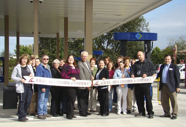 Sam's Club staff join Auburn Mayor Pete Lewis and members of the Auburn Area Chamber of Commerce in a ribbon-cutting ceremony