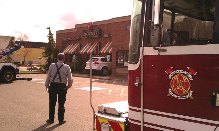 An errant vehicle is towed out of the Auburn Applebees.