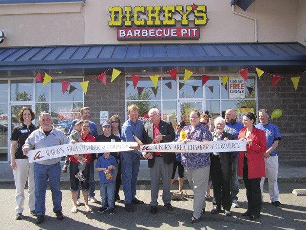Auburn Mayor Pete Lewis and members of the Auburn Area Chamber of Commerce joined Dickey's Barbecue Pit owner Gary Depping in a ribbon-cutting ceremony Friday.