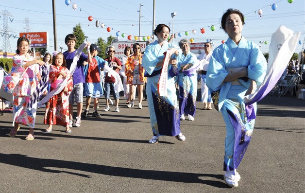 The White River Buddhist Temple teachers lead a dance during last weekend’s Bon Odori Festival.
