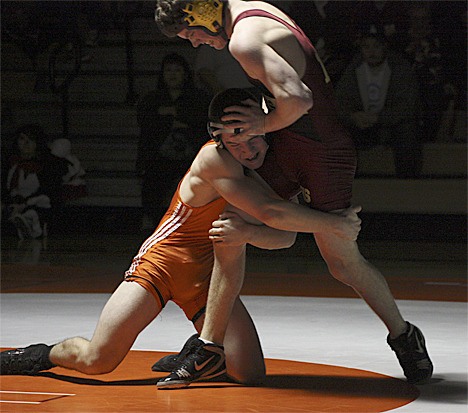 Enumclaw's Josh Musick fights off Auburn Mountainview's Tyler King during Thursday's Hornet versus Lion dual at Auburn Mountainview High School.