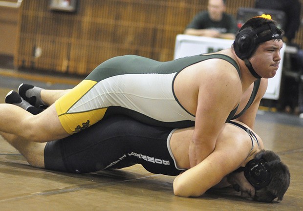 Jacob Apodaca roughs up Bonney Lake’s David Smith in the 285-pound final at the South Puget Sound League 3A sub-regional wrestling tournament. Apodaca earned a trip to this Saturday’s regional tourney with a 5-2 decision.