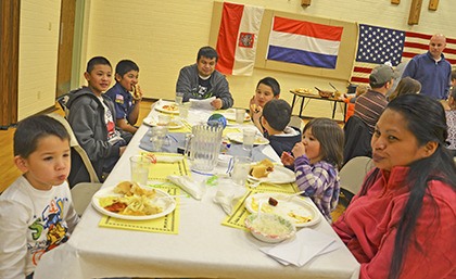World flavor: Families sampled food from other countries during the Blue and Gold Family Style Dinner in Auburn.