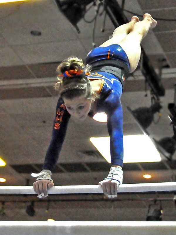 Auburn Mountainview's Kayla Porter compete in the uneven bars at the state meet.