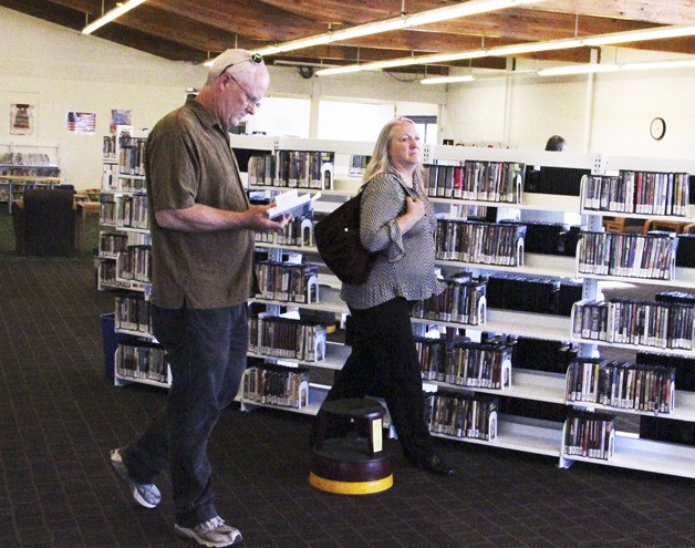 Jackie and Brent Callendar peruse the temporary library
