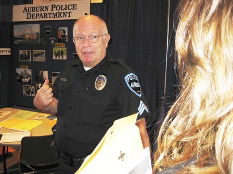 Auburn Police Sgt. Hans Krenz explains the nature and requirements of his profession to interested students at this week’s career conference.
