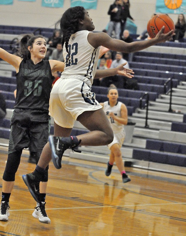 McKenzi Williams drives for two of her 18 points against Peninsula