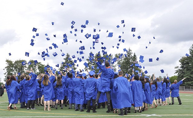 Auburn Mountainview High School’s graduating class of 2016 tosses caps into the air following the commencement program at Auburn Memorial Stadium last Saturday.
