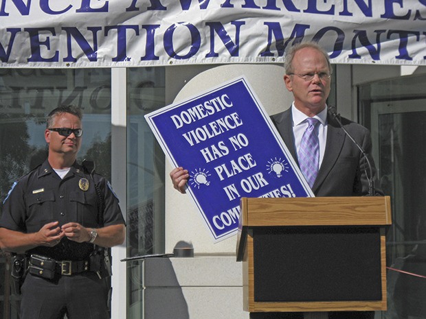 King County Prosecutor Dan Satterberg addresses the crowd during a regional law enforcement domestic violence awareness rally on the front steps of the Norm Maleng Regional Justice last Friday.
