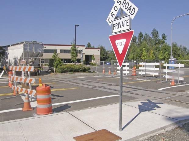 Auburn’s planned opening of the A-B Street corridor is being held up by Burlington Northern Santa Fe Railroad’s demand for a fully-signalized crossing.