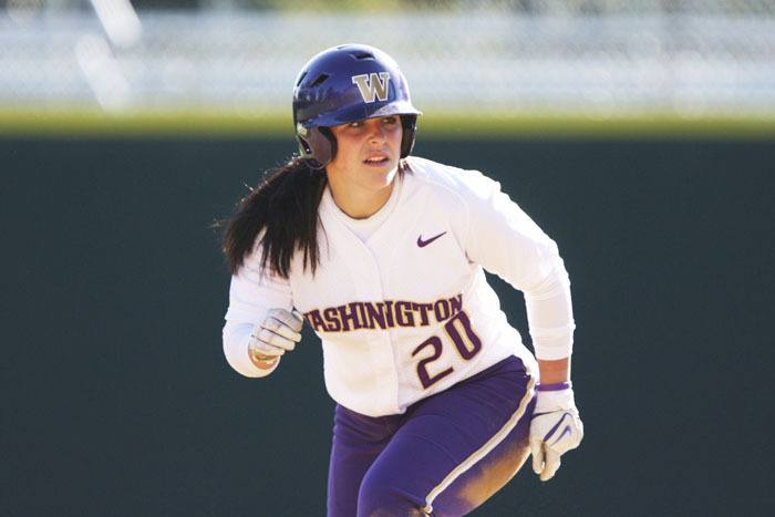 Bailey Stenson on the basepath for the Washington Husky fastpitch team.