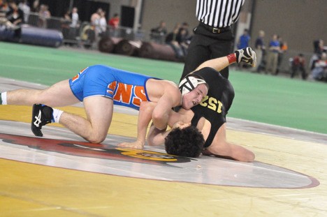 Auburn Mountainview's Tyler King manhandles Enumclaw's Josh Musick in the 152-pound 3A title match at Mat Classic XXII.