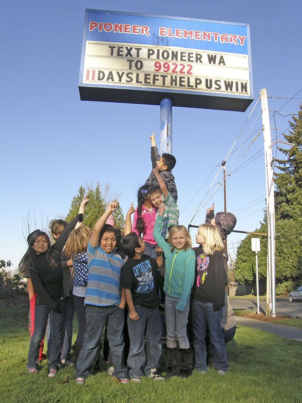 Pioneer Elementary School students gather in front of the school on Tuesday