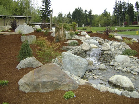 Mountain View Cemetery is graced by a new 70-foot water feature and redesign of the landscaping area in the front of the office and parking lot area.