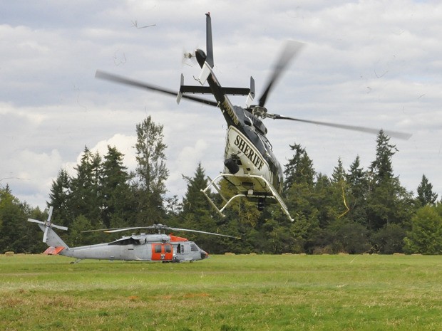 Helicopters from the King County Sheriff’s Office