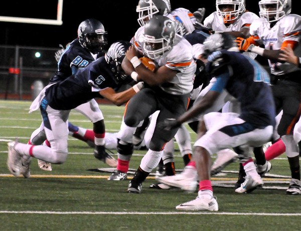 Auburn Mountainview's Nate Hardin powers through the Raven defense.