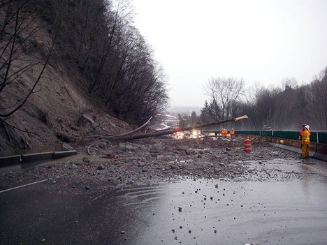WSDOT crews monitor the landslide that closed all lanes of westbound SR 18 during this morning's comute.