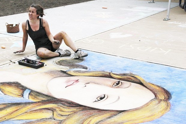 Gabrielle Abbott talks about her chalk art creation during last year's ArtRageous Festival. The community art celebration returns to Auburn on Aug. 4.