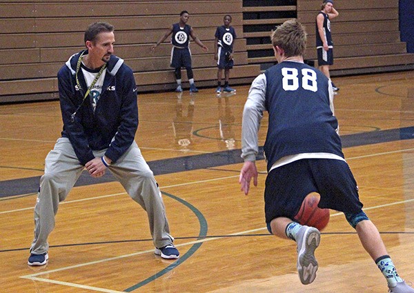 Kevin Olson takes over the Auburn Riverside boys basketball program